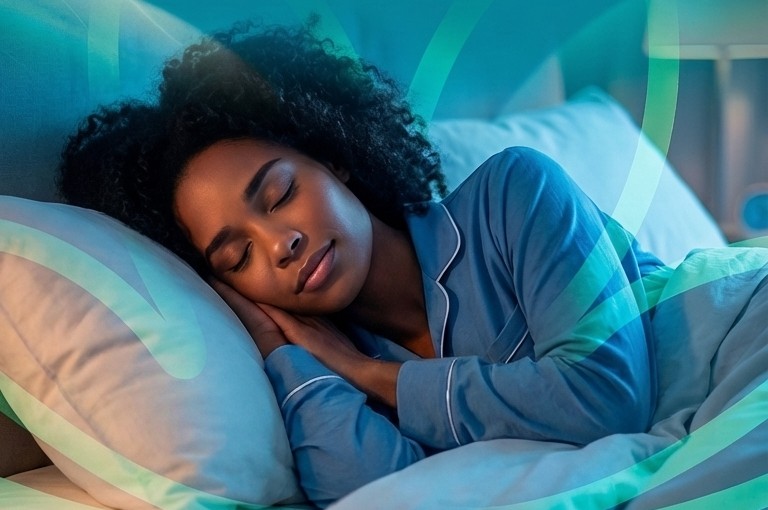 A woman sleeping peacefully, representing the importance of sleep for physical, mental and emotional health.